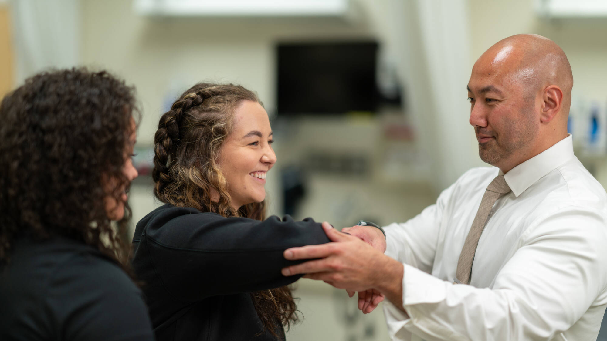 Faculty member demonstrating examination technique